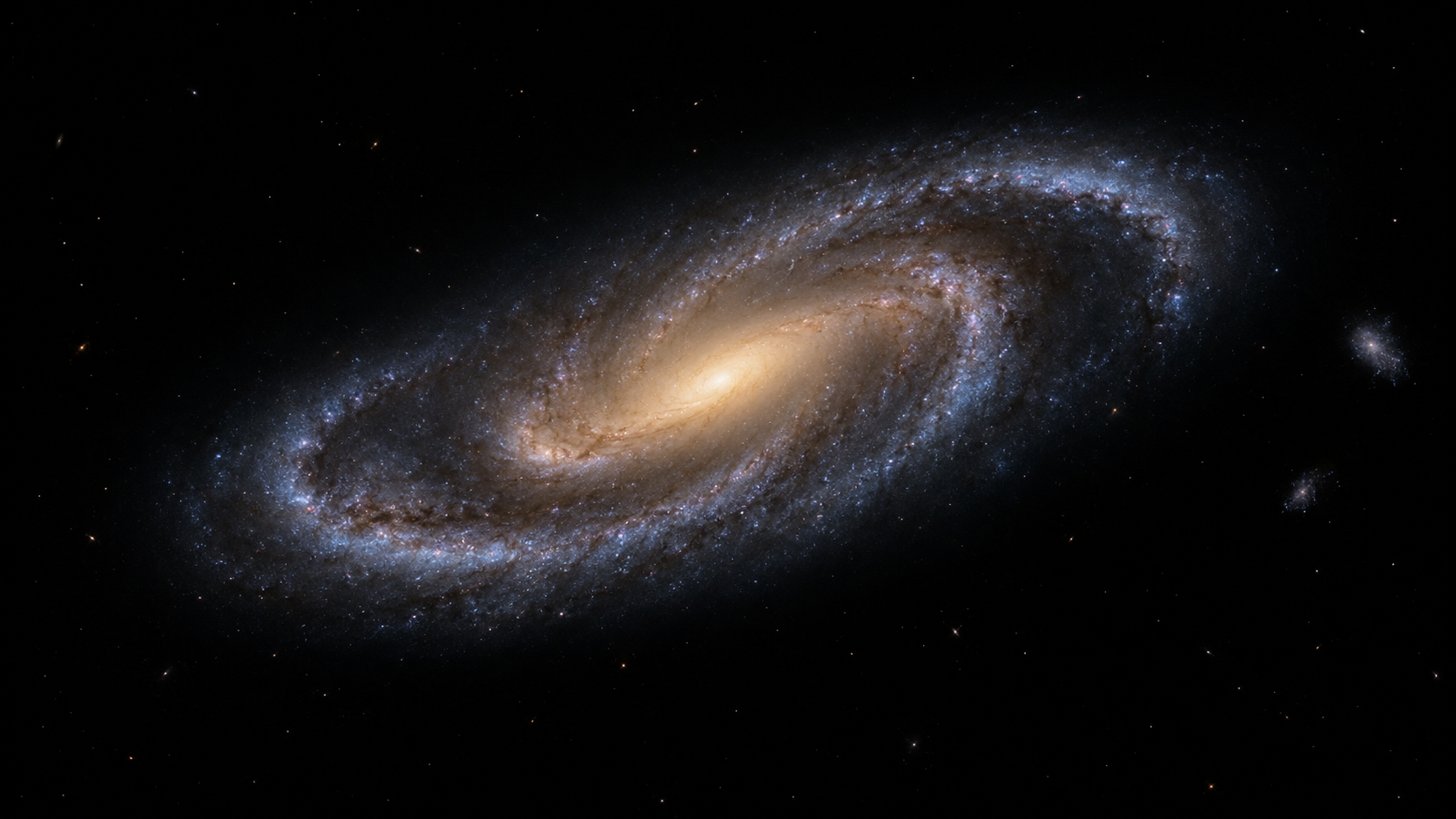 A distant oval galaxy: two broad blue spiral arms curl around a smooth golden bar.